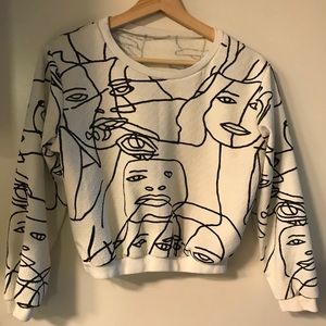 Abstract face sweater